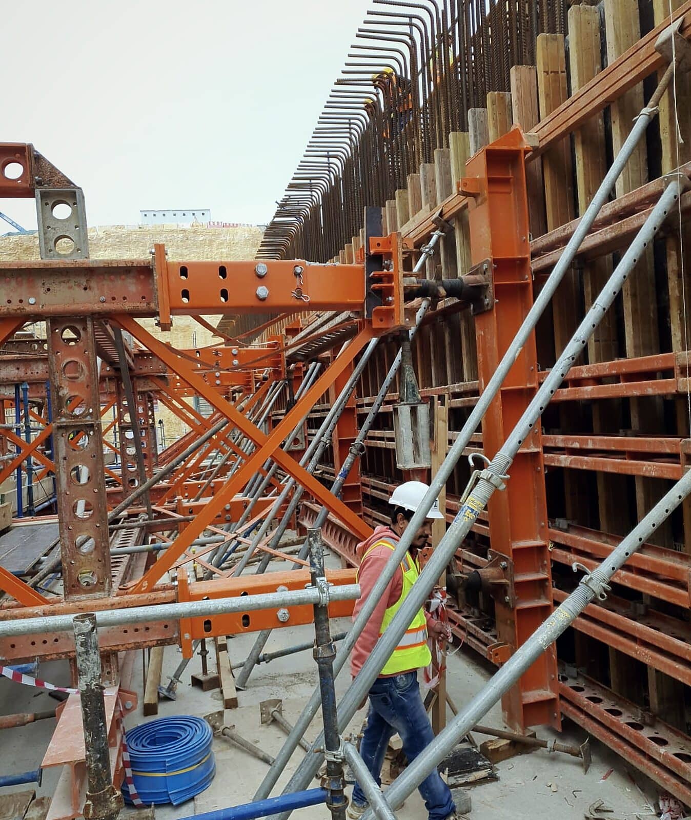 Wall formwork held by soldier frames, with working platforms