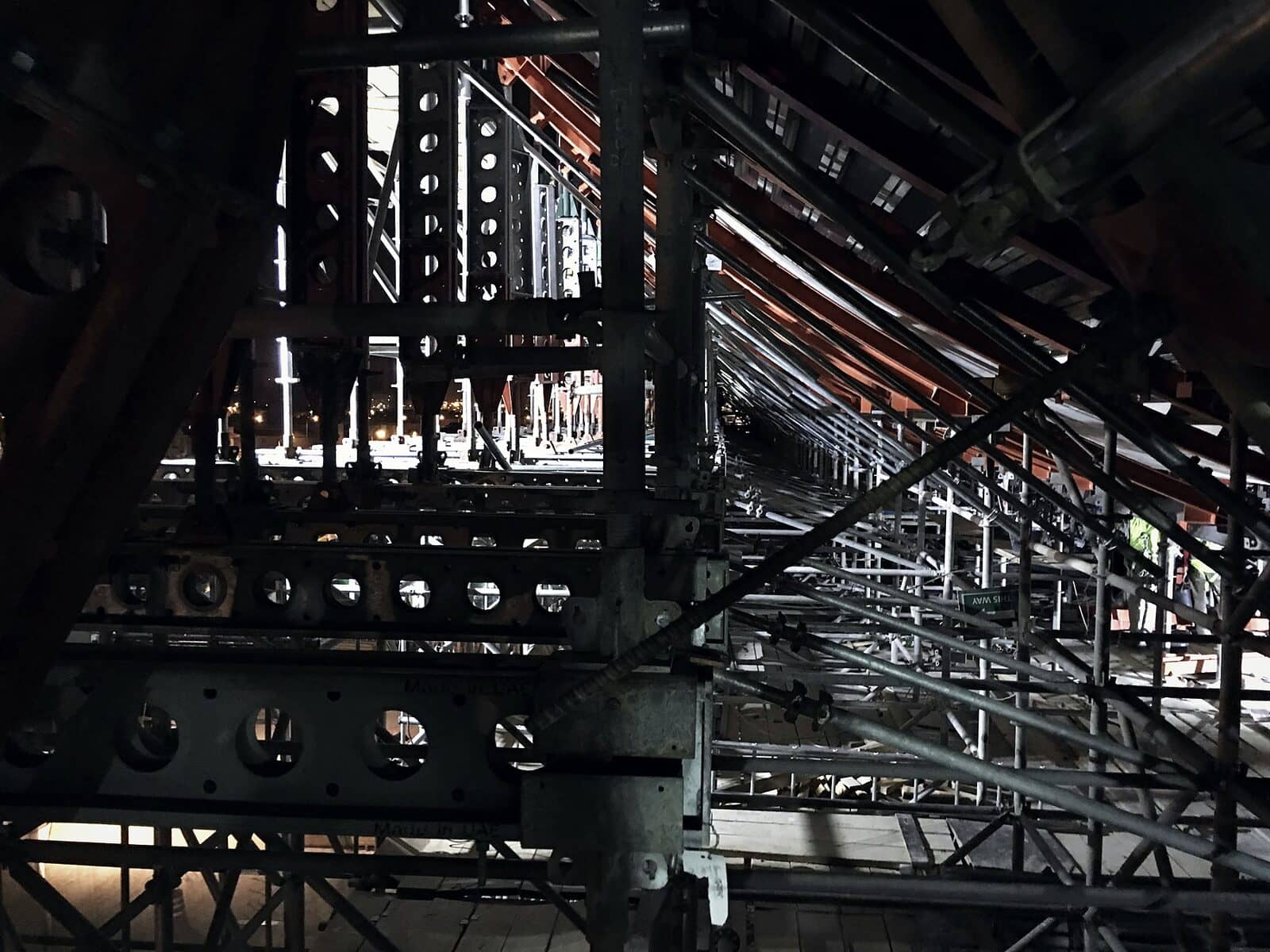 Steel falsework towers and beams carrying a slab soffit before the pour